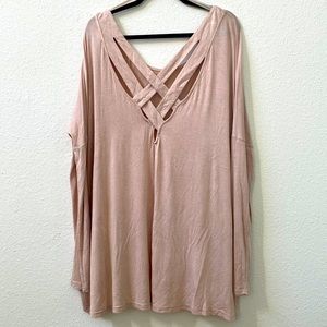 Pale pink long sleeved tunic with crisscross detail on back